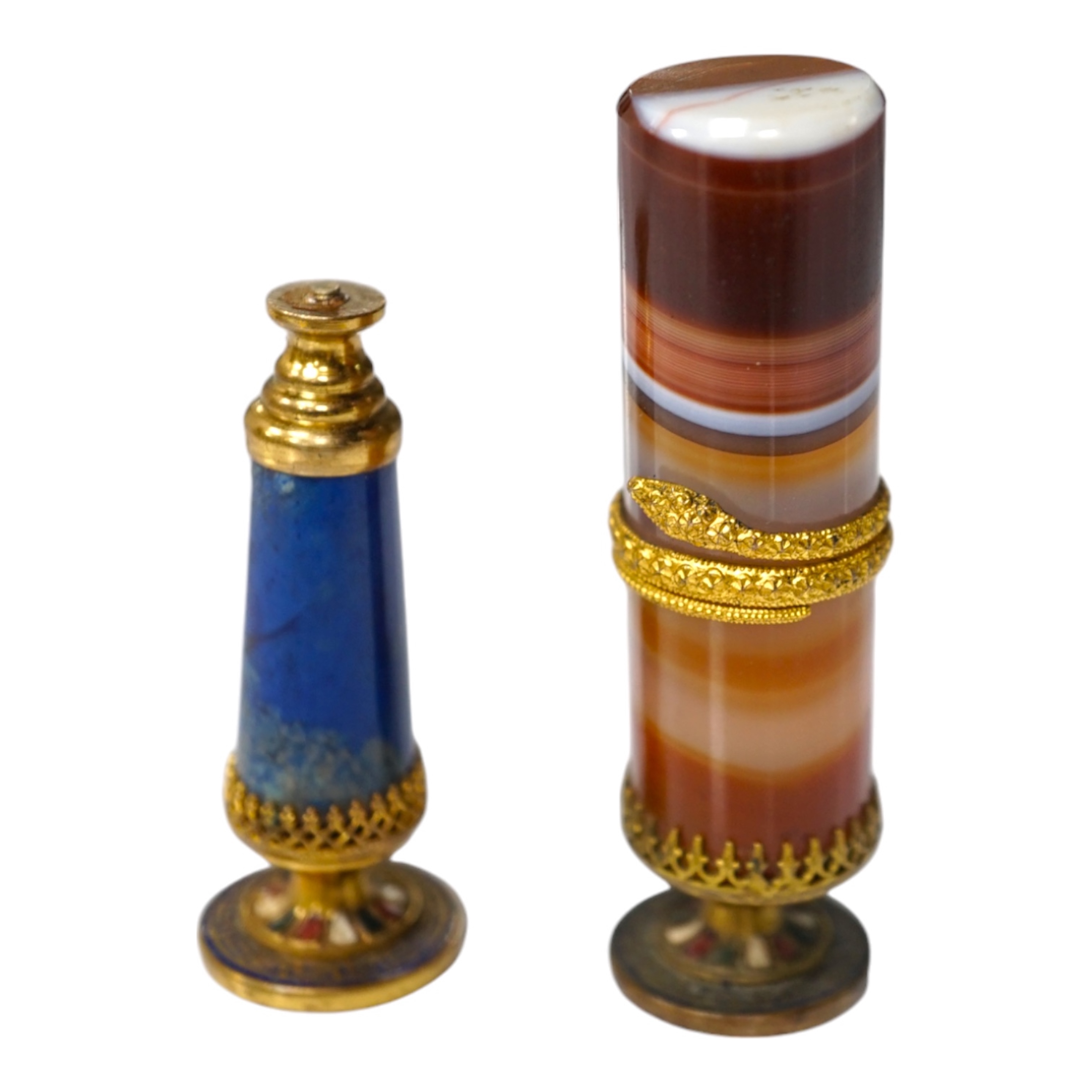 A 19th century agate and gilt metal table seal with gilt snake decoration and a smaller lapis lazuli seal, tallest agate seal 7cm high (2). Condition - fair